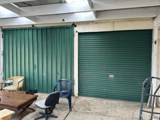 Double garage space with storage shelves