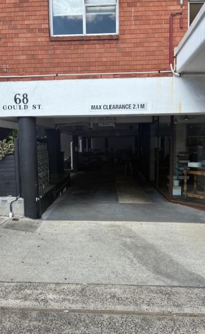 Front row / first spot under the building next to shops and 30 second walk to beach.