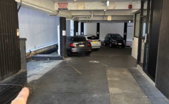 Front row / first spot under the building next to shops and 30 second walk to beach.