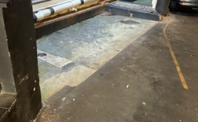 Front row / first spot under the building next to shops and 30 second walk to beach.